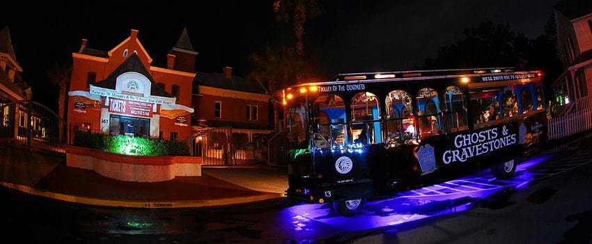 A bus embarking on a tour for Ghosts and Graveyards Tour, shows tourists spooky stops in Boston.