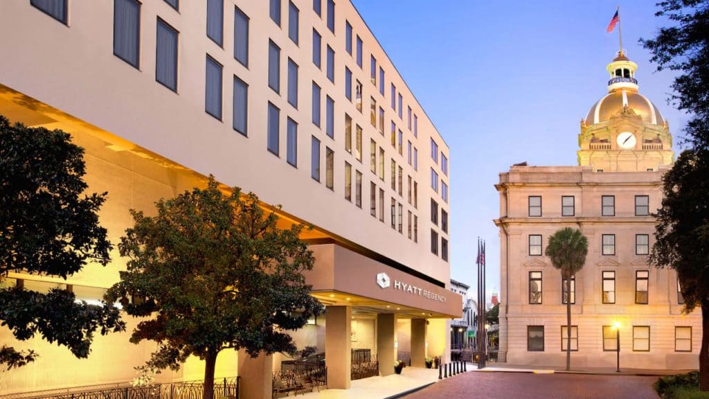 The entrance to the Hyatt Regency Savannah, lit at night.