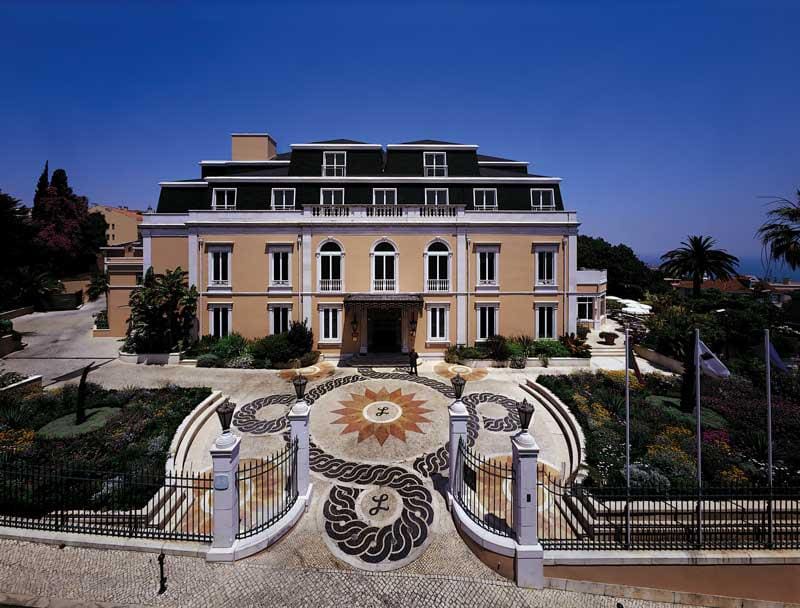 The grand outdoor entrance to Olissippo Lapa Palace Hotel, one of the best Lisbon hotels for families.