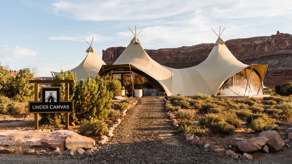 The entrance to Under Canvas Moab, with it's inconic canvas peaks in the distance.