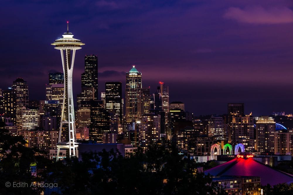 A view of the Seattle skyline at night, prominently featuring the Space Needle, a must stop on your 3-day Seattle itinerary for families.