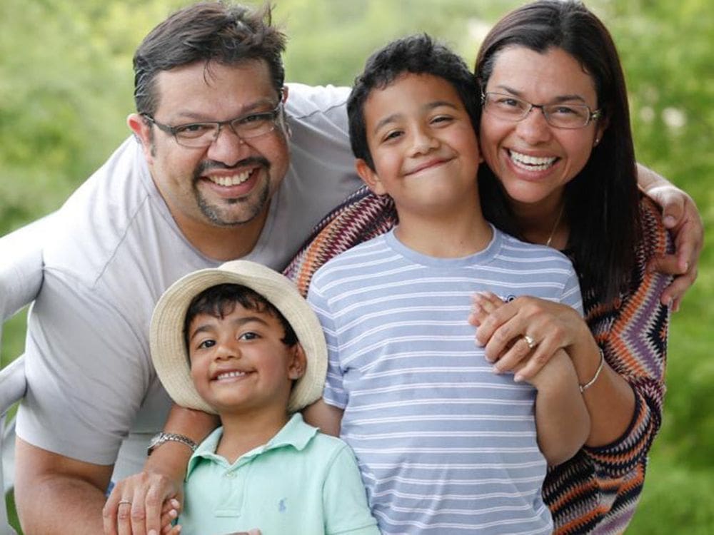 A family of four smiles together in Seattle.