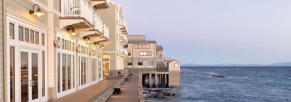 A view of the InterContinental The Clement Monterey along the shoreline in California.