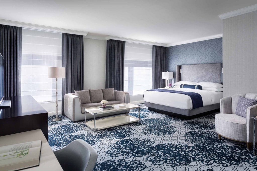 Inside one of the well-furnished room at the The Ritz-Carlton, San Francisco, with blue and white interior decorations.