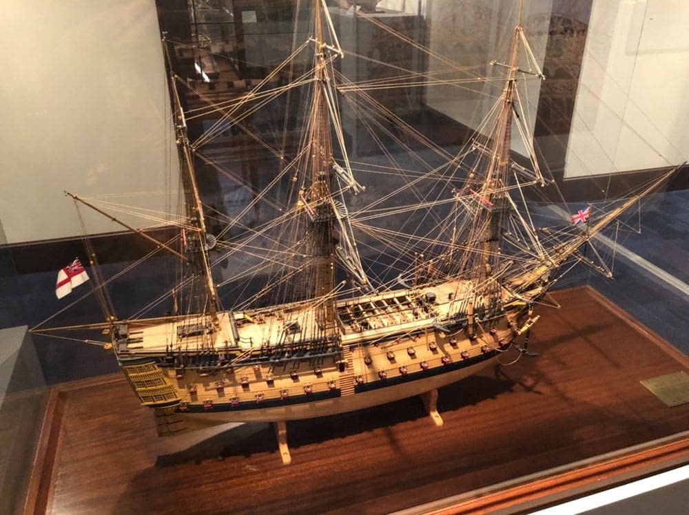 A model ship inside an exhibit case at the U.S. Naval Academy Museum, one of the best things to do on your weekend getaways near Baltimore for families.