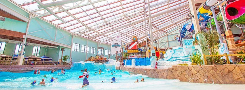 Inside the large indoor water park at Camelback Resort and Water Park, featuring a huge splash zone and indoor slide.