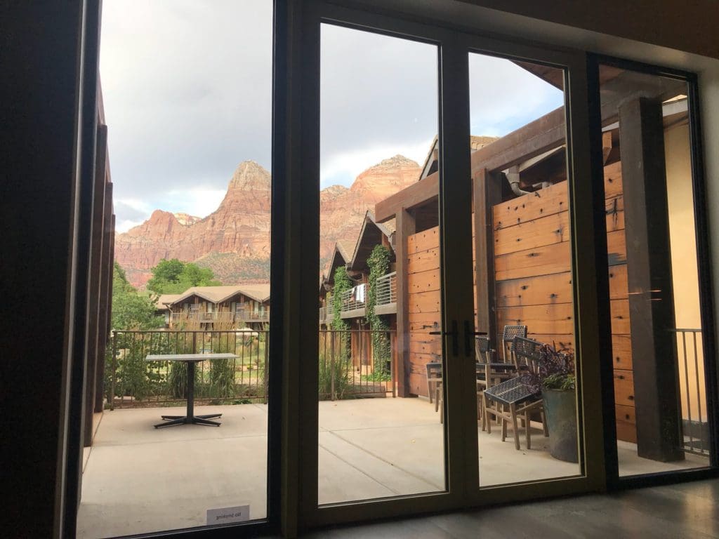 A view of the desert rock formations from inside a guestroom at Cliffrose Springdale, Curio Collection By Hilton.