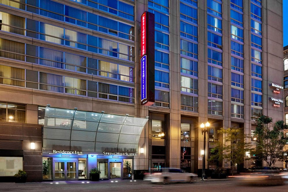 A close-up view of the entrance and sign for the Residence Inn by Marriott Chicago Downtown / River North at night.