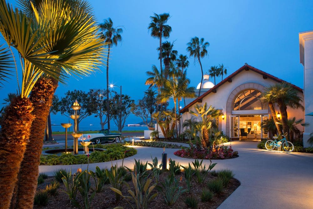 The brightly lit entrance to the Kona Kai Resort & Spa, at night, one of the best San Diego beachfront hotels for families.