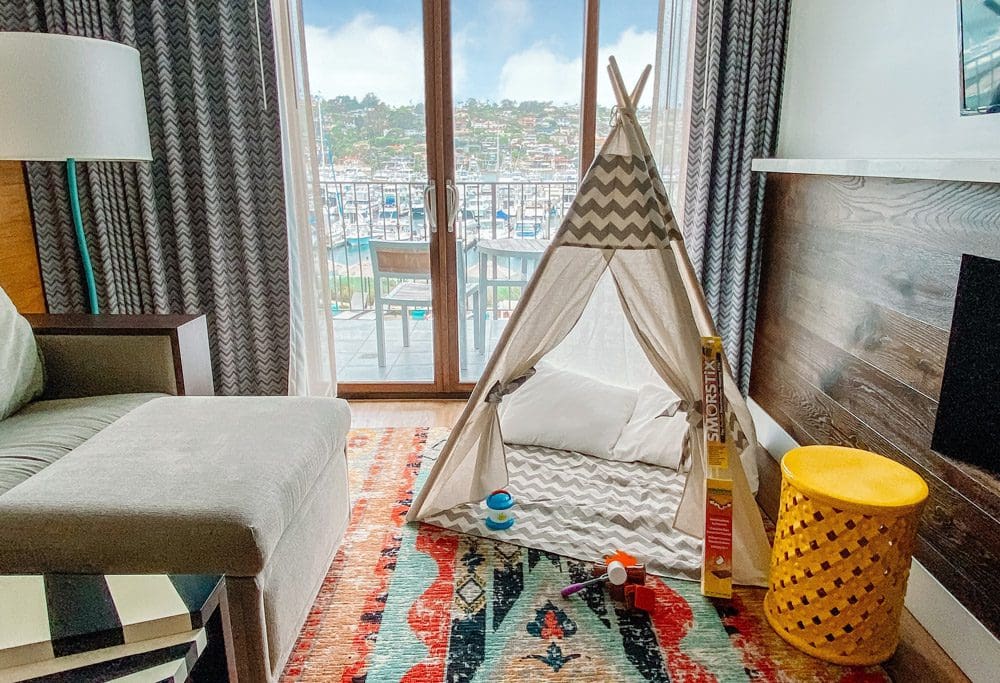 Inside one of the rooms at Kona Kai Resort & Spa, featuring a kid's teepee.
