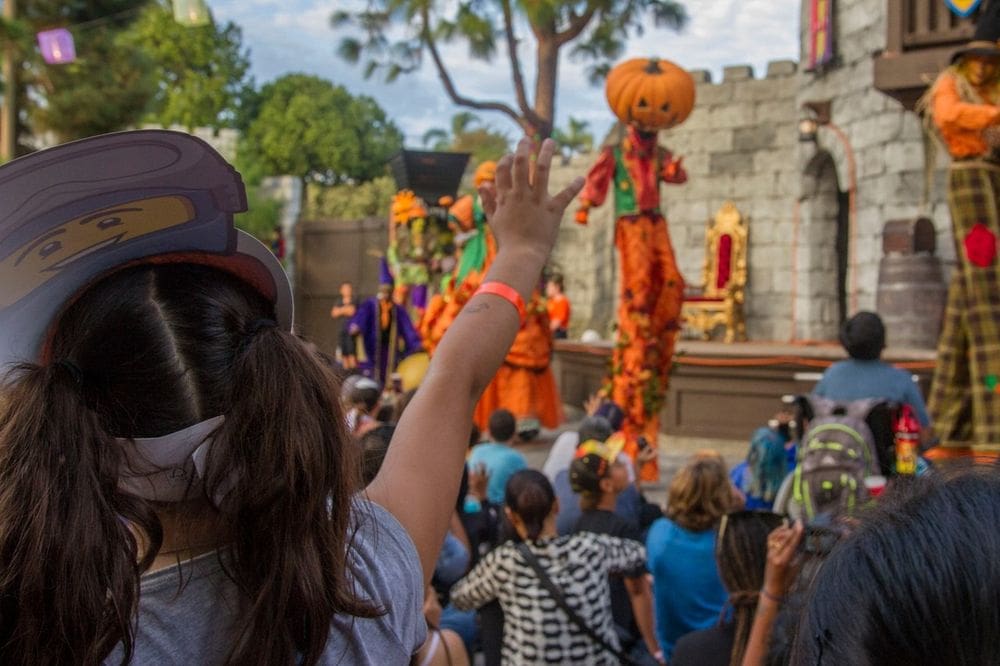 Several people enjoy a parade during the fall at Legoland.