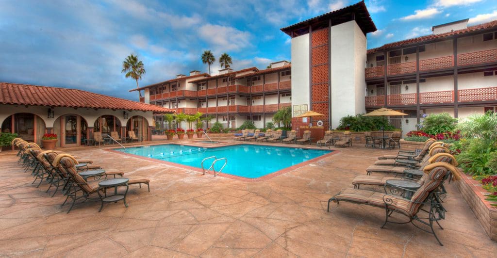 A view of the pool and pool deck, with loungers, at the La Jolla Shores Hotel.