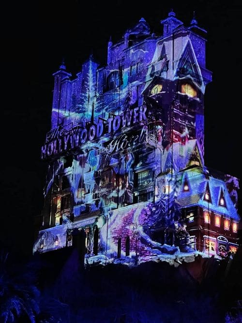 The Tower of Terror lit up like Elsa's frozen castle.