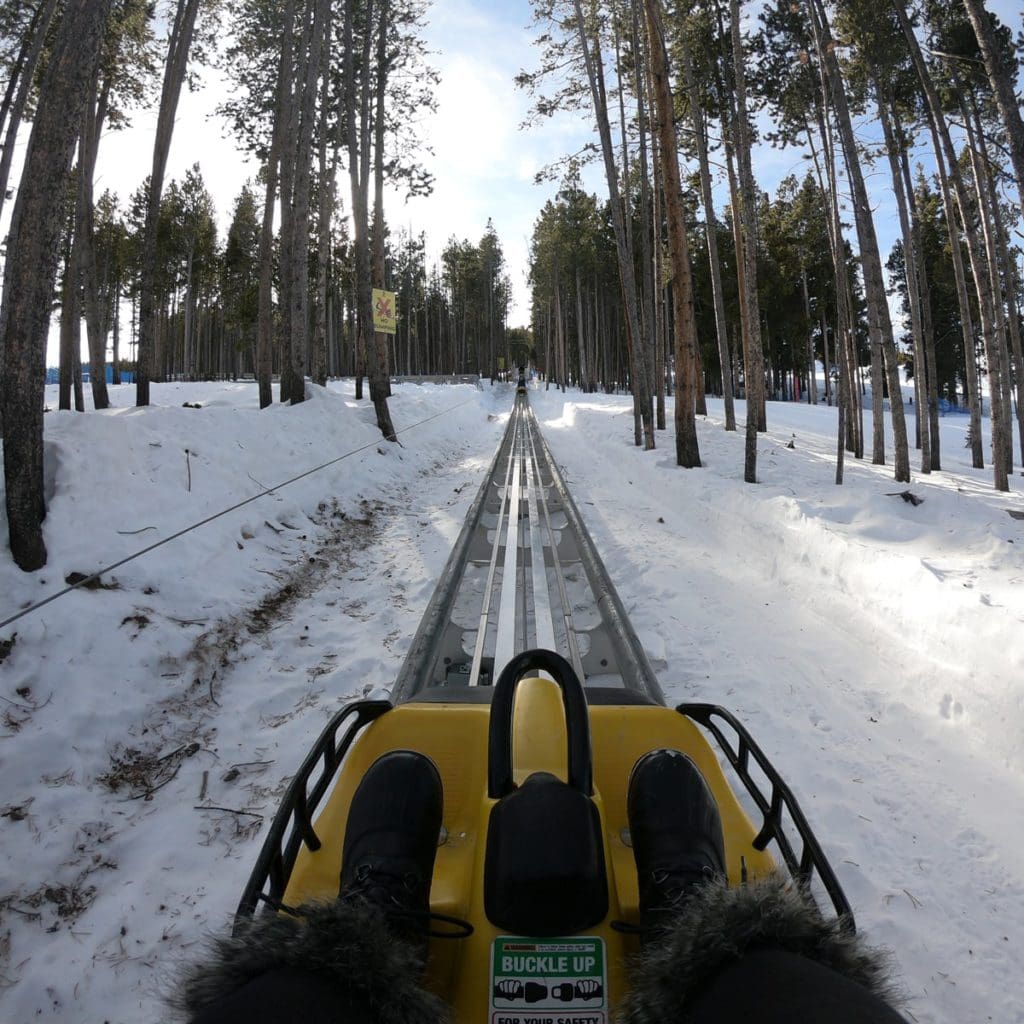 A pair of black boots rest in the footholds of the Alpine Coaster in Breckenridge.