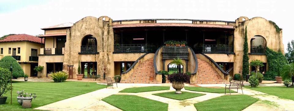 The grand entrance to Hacienda Campo Rico, one of the best things to do in Puerto Rico with kids.