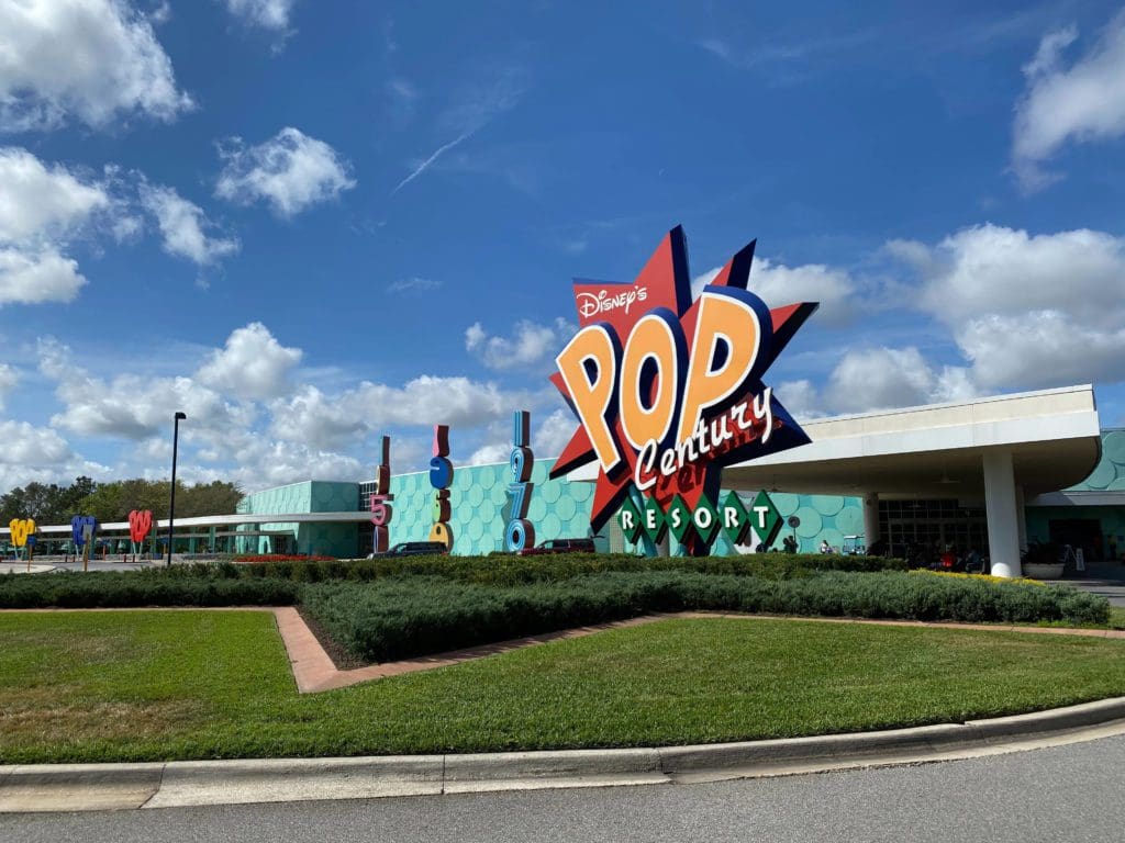 The entrance to Disney’s Pop Century Resort, featuring a large sign reading "POP".