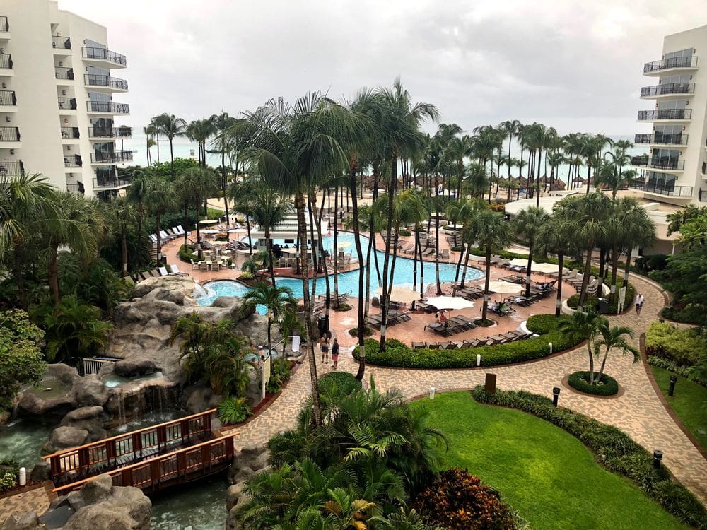 An aerial view of the hotel pool and grounds at Marriott Aruba Stellaris.