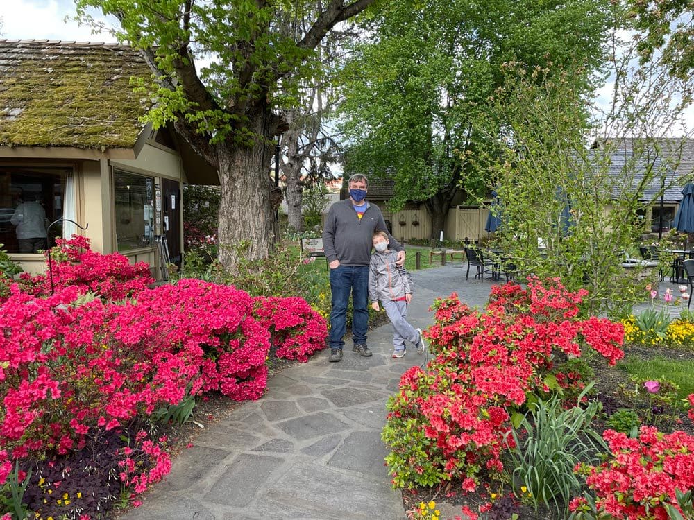 A man and his young son stand together at the Old Mill Pottery Cafe in Gatlinburg, one of the best things in a family itinerary for Gatlinburg Pigeon-Forge.