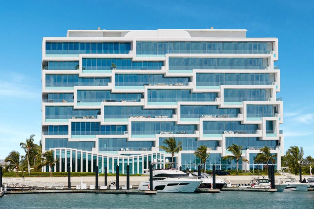A view of the large building along the water at the Albany, The Bahamas, one of the best hotels in the Bahamas for families.