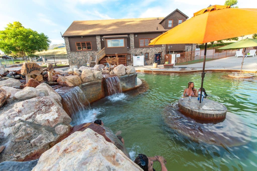 A family enjoys the hot springs at the Crystal Hot Springs.