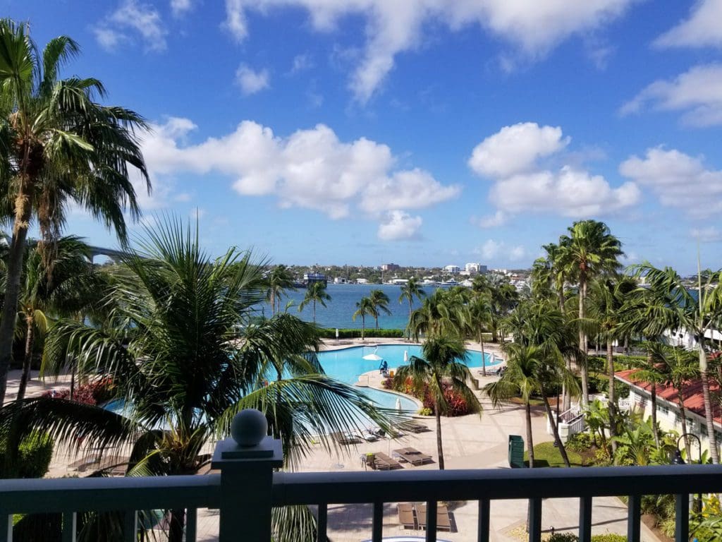 A view of the pool at the Harborside Resort, from a room balcony, one of the best hotels in the Bahamas for families.