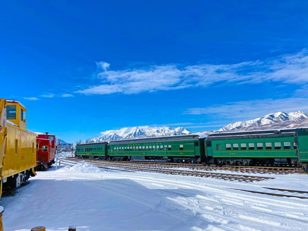 Two trains rest at the train yard for Heber Valley Railroad, one of the best things to do when visiting Deer Valley with kids.