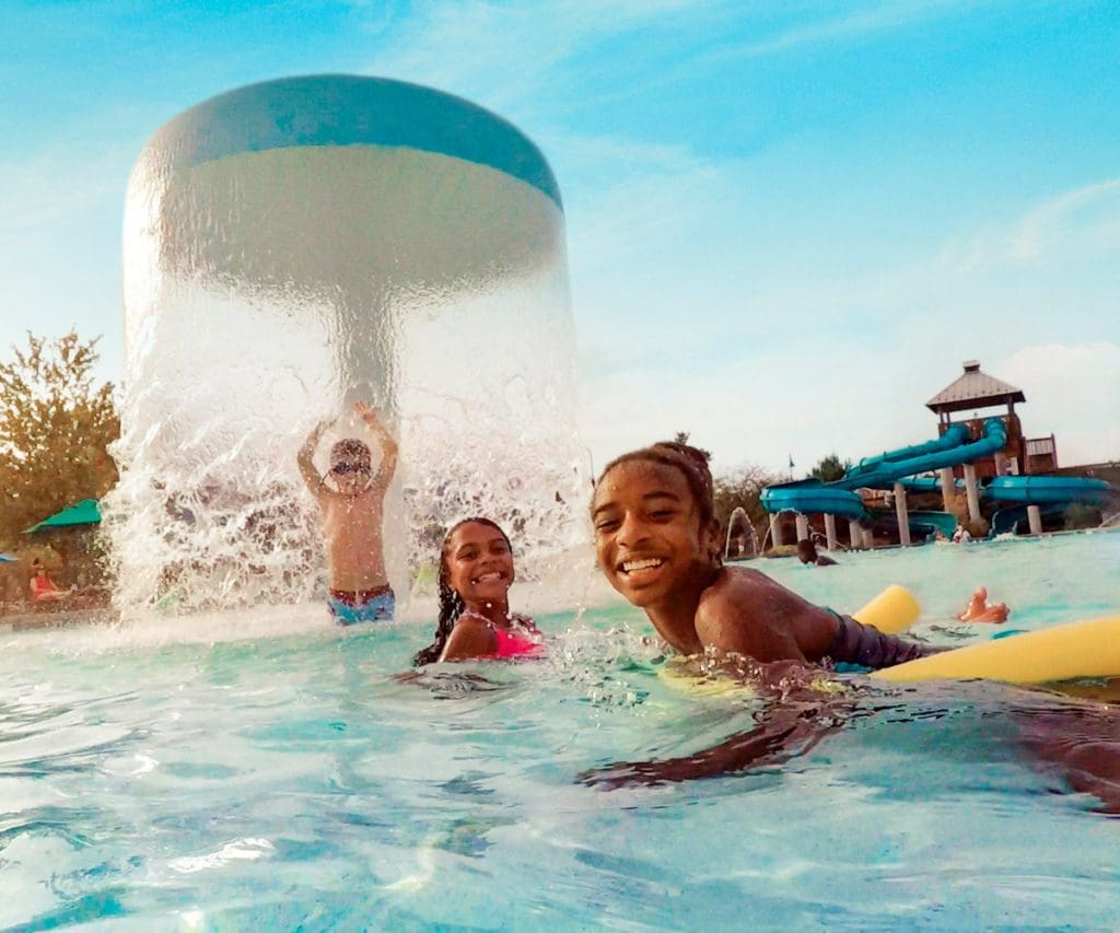 Two kids playing at the water park at Hotel Hershey.