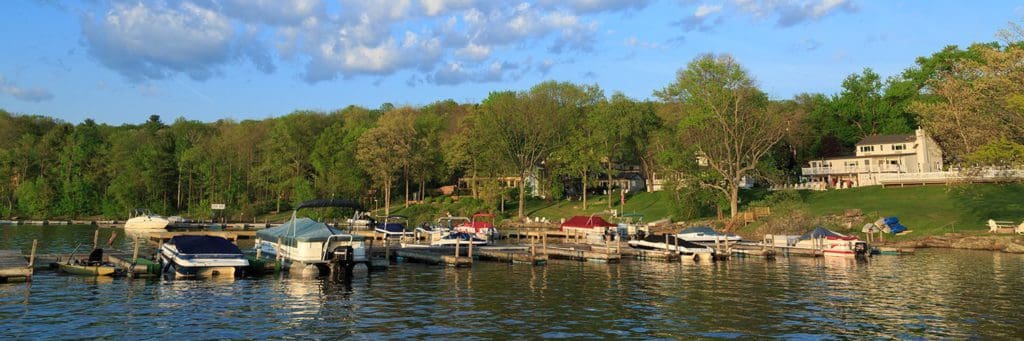 A view of the Silver Birches Resort, featuring a lake side location, docks, and boats.