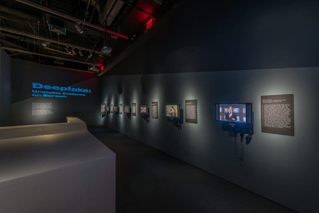 A dark hallway featuring film exhibits at the Museum of the Moving Image.