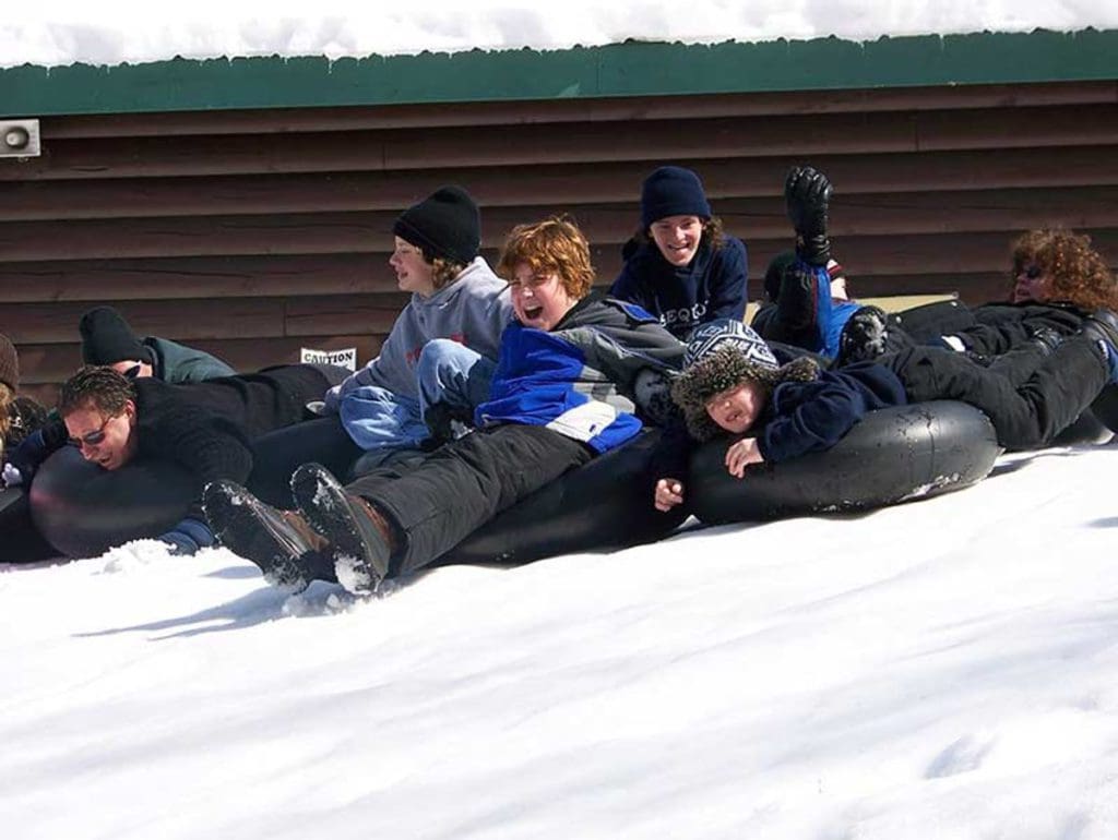 Several kids go snow tubing at the Ridin-Hy Ranch Resort.