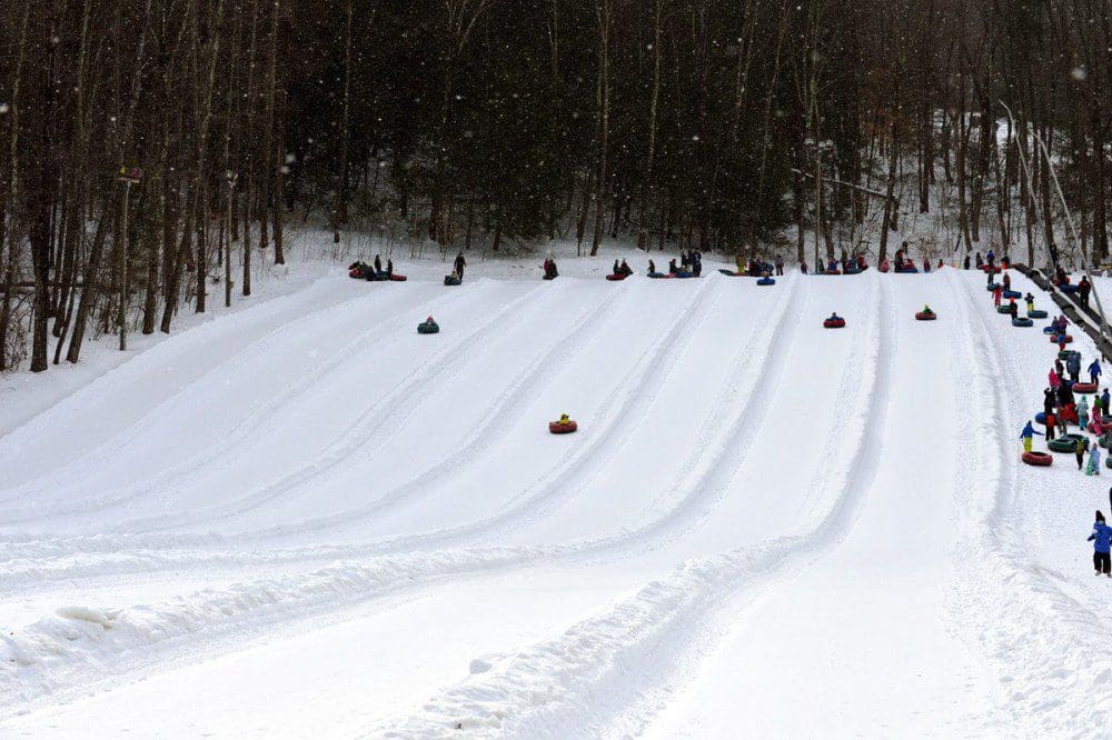 Several snow tube runs at Ski Butternut, all featuring riders on snow tubes.