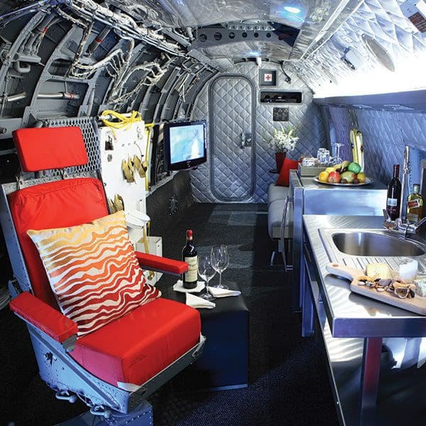 Inside the helicopter-themed room at Winvian Farm, featuring a pilot's seat and other helicopter featurers.