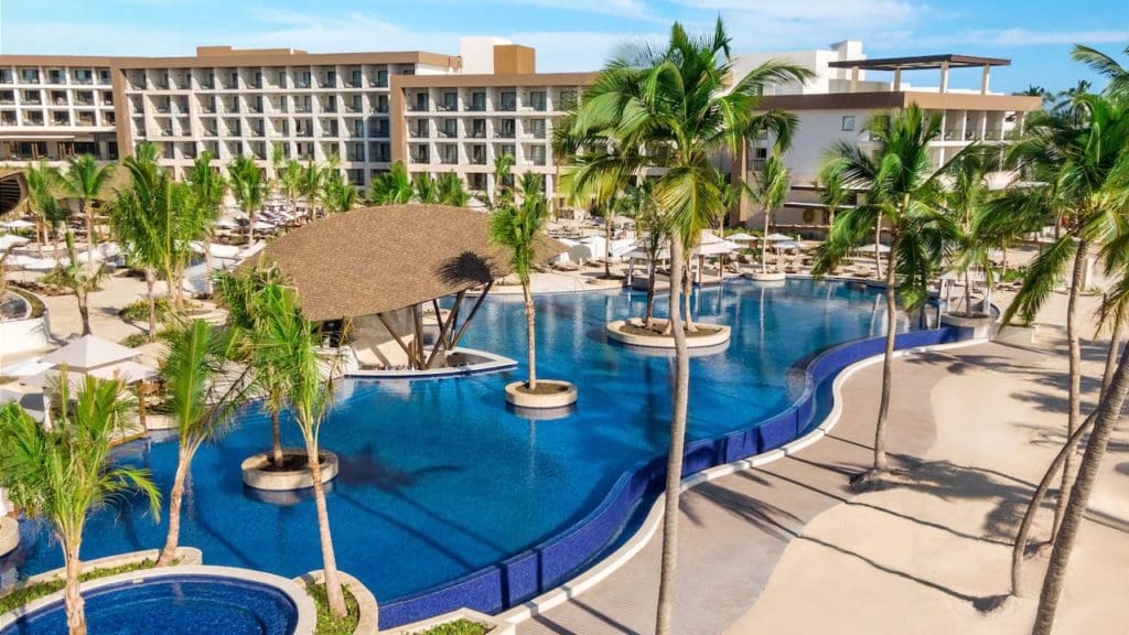 An aerial view of the tranquil pool and surrounding palms at Hyatt Ziva Cap Cana.