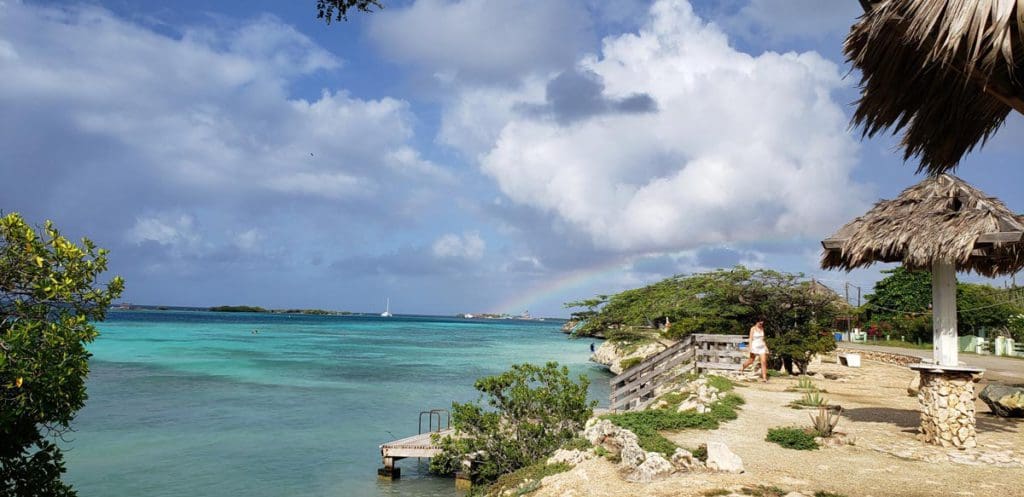 A view of Mangel Halto, featuring a cabana and shoreline.