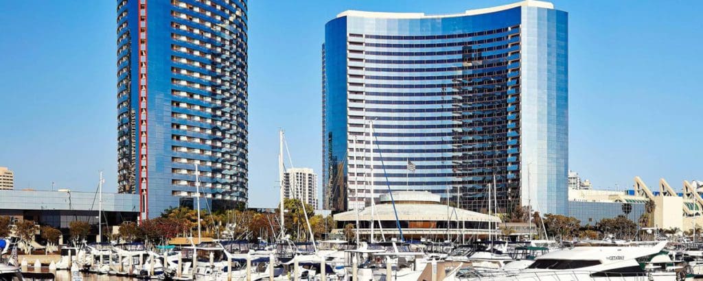 The Marriott Marquis San Diego Marina behind the nearby marina, one of the Best Marriott Properties in the U.S. for a Family Vacation.