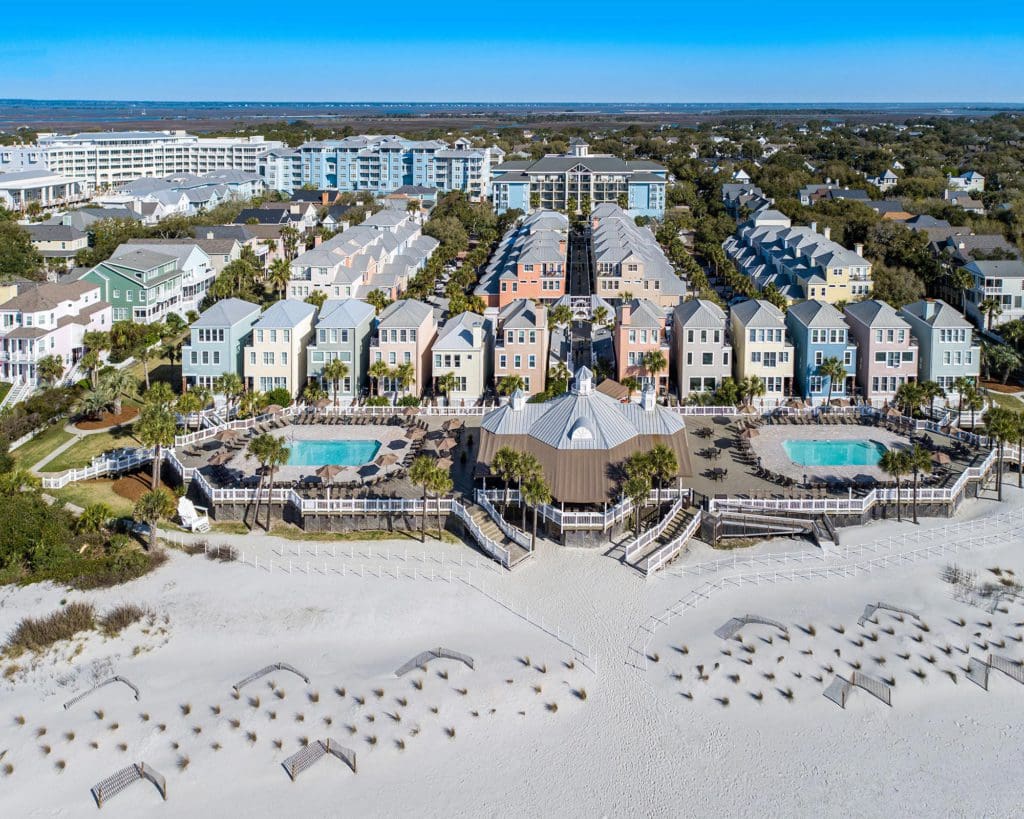 An aerial view of Wild Dunes Resort, featuring its lush grounds, pools, and beachside location.