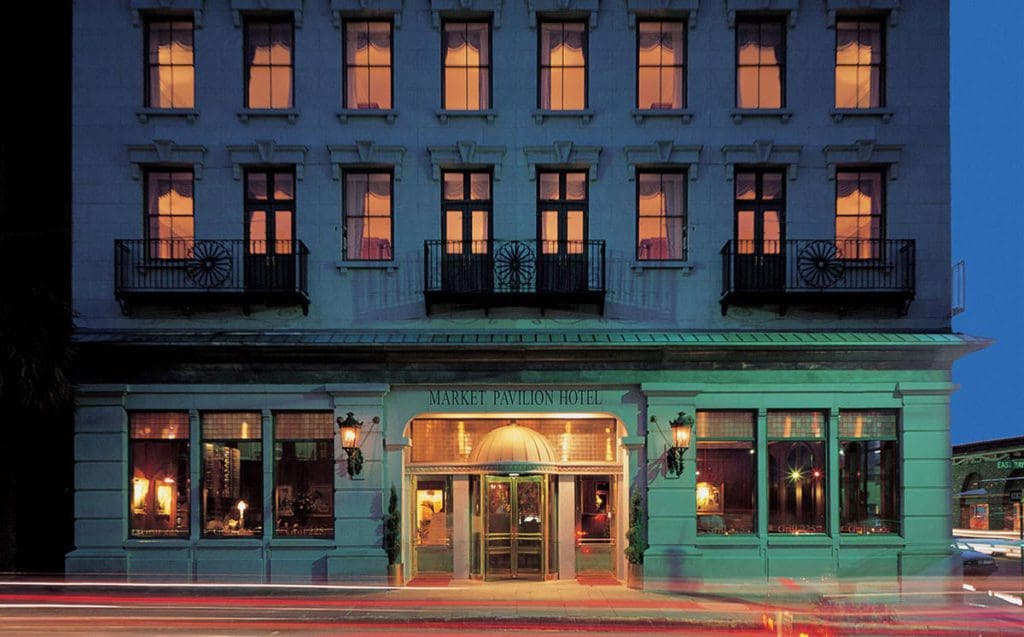 The entrance to Market Pavillion Hotel, well-lit at night.