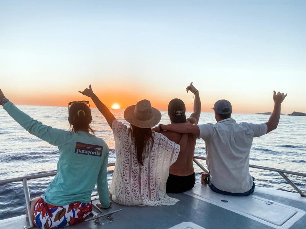 A family sitting on a boat in Samara, Costa Rica.