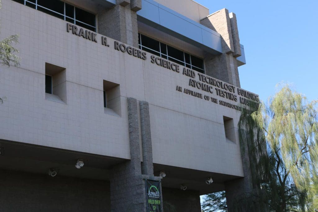 The exterior of the National Atomic Testing Museum, with the name of the museum on the side of the building.