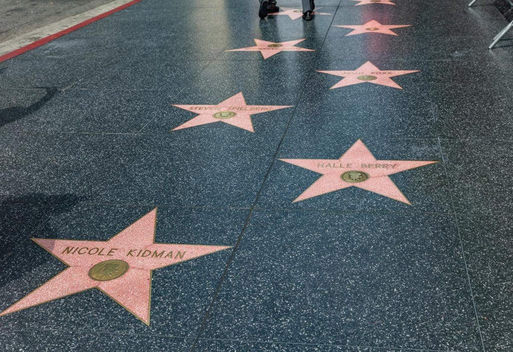 Several iconic stars along the Hollywood Walk of Fame, one of the best things to see in Los Angeles with teens.