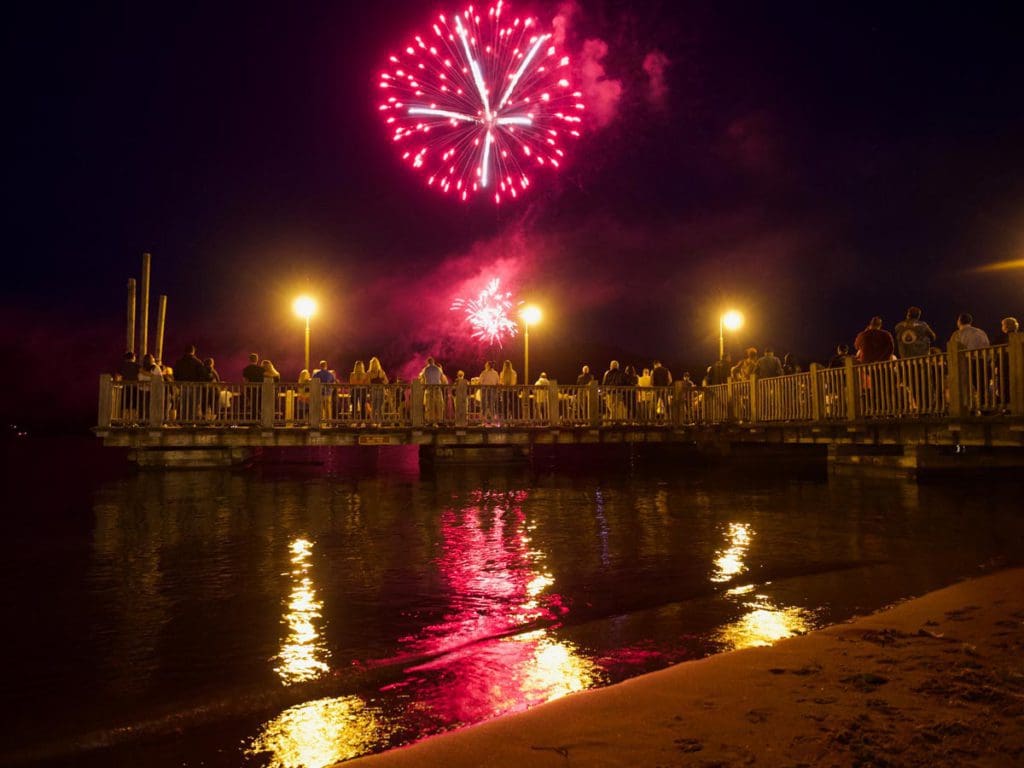 Several fireworks go off over the lake in Lake George.