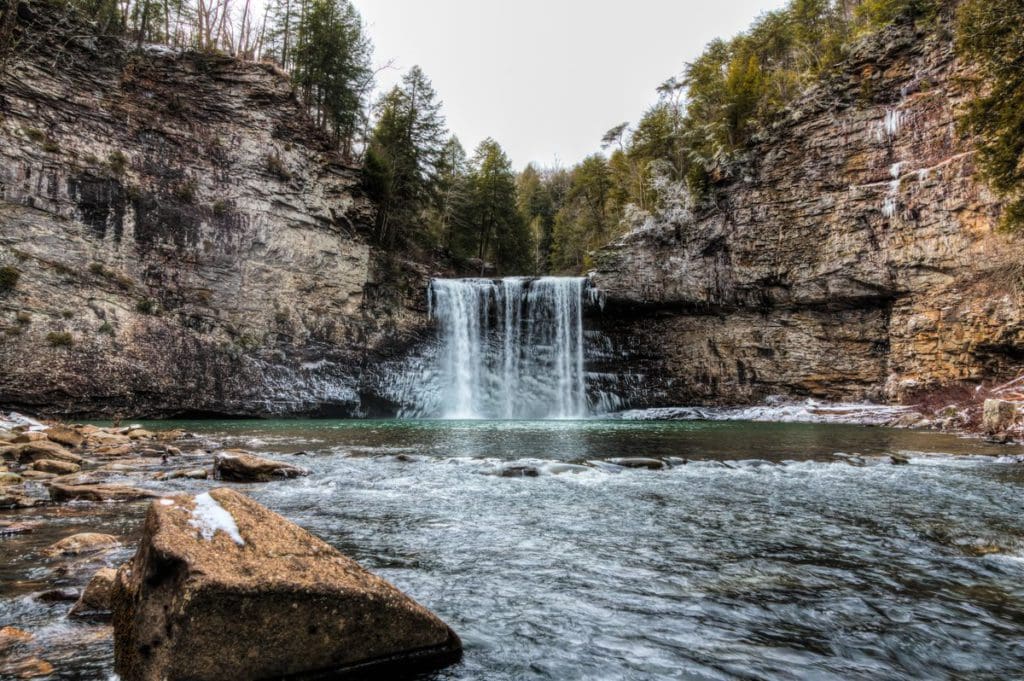 The stunning water falls at Fall Creek Falls State Park, as well as the surrounding river and rocky shore.
