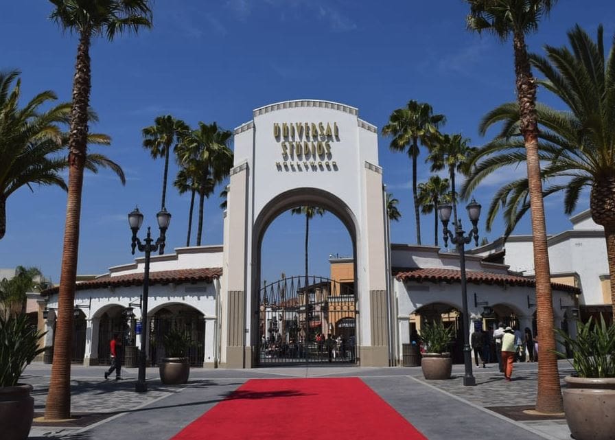 The arched, iconic entrance to Universal Studios on a sunny day, one of the best things to do in Los Angeles with teens.