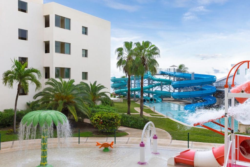 The splash pad at Hyatt Ziva Riviera Cancun, featuring colorful slides and fun water features.