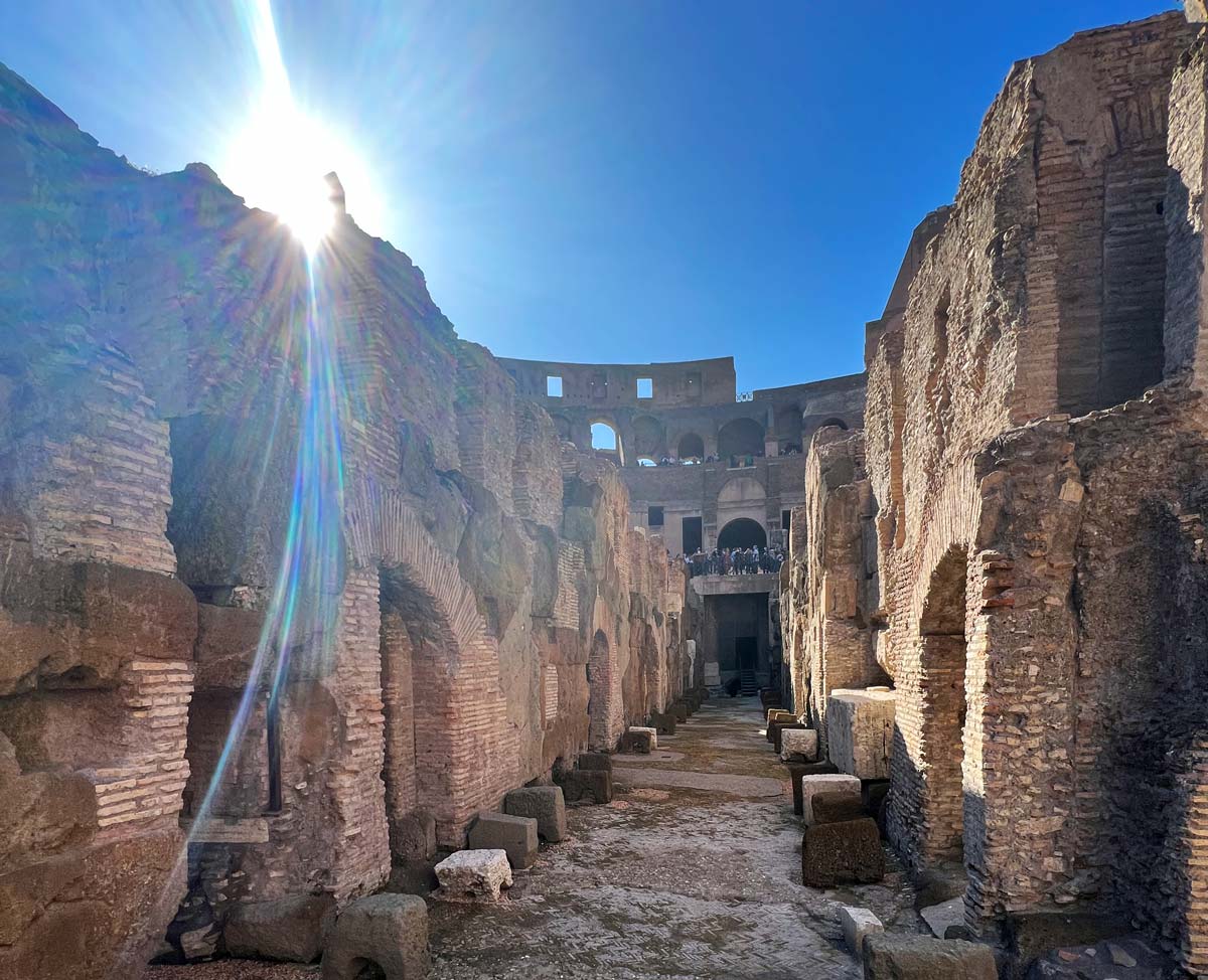 Along the underground corridors of the Colosseum, open air during a guided tour.