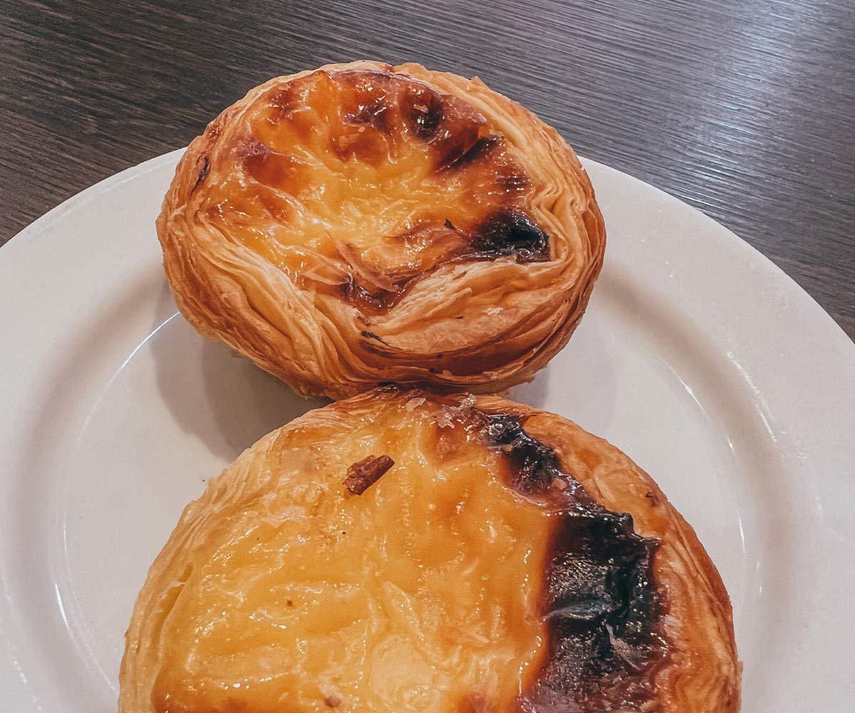 Two traditional Porto pastries on a plate.
