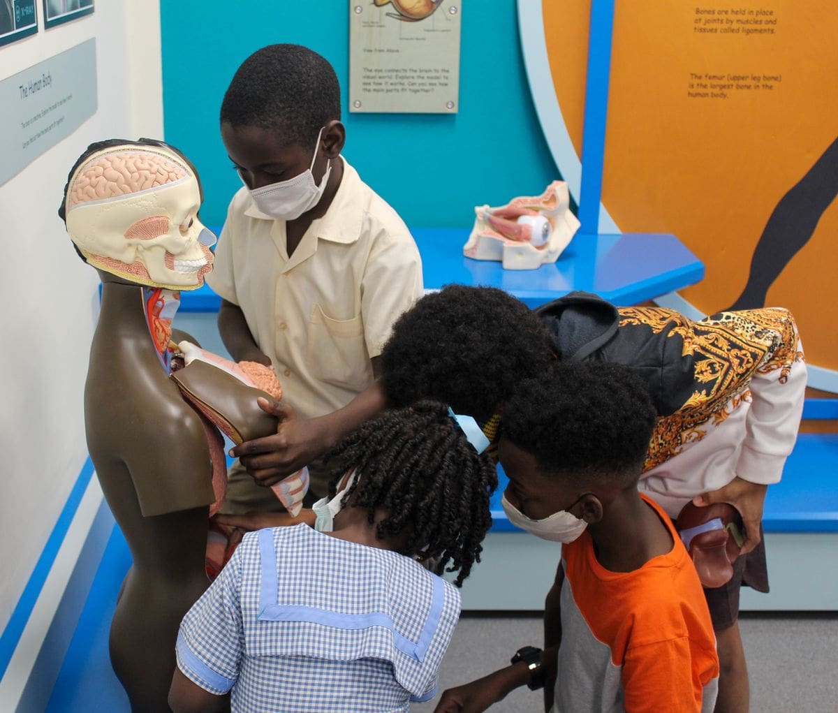 Kids play together within an exhibit in the Jairus Brewster Children's Gallery featuring the exhibit 'Explore'.