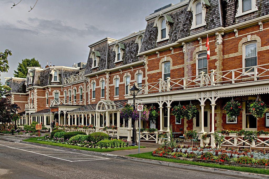 A row of historic brick houses along a street in Niagara-On-The-Lake, one of the best vacation destinations for families In Canada.