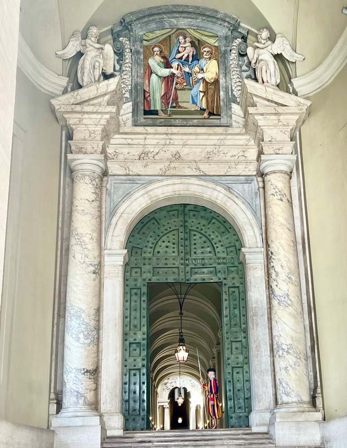 The entrance to a grand hallway in St. Peter's Basilica in Rome.