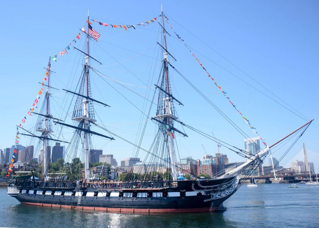 The USS Constitution proudly sailing through Boston Harbor. This is one of the best places to visit on a Boston itinerary for families! 